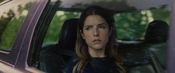 Movie still from “Alice, Darling” (2022), directed by Mary Nighy – A woman sitting in the back seat of a car looking out the window; Close Up shot, Over the shoulder angle