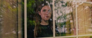 Movie still from “Alice, Darling” (2022), directed by Mary Nighy – A woman looking out of a window at the trees; Close Up shot, Over the shoulder angle