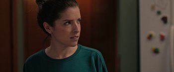 Movie still from “Alice, Darling” (2022), directed by Mary Nighy – A person wearing a green shirt; Close Up shot, Over the shoulder angle