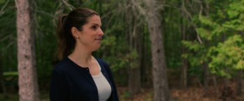 Movie still from “Alice, Darling” (2022), directed by Mary Nighy – A woman standing in front of a tree in the woods; Close Up shot, Over the shoulder angle