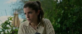 Movie still from “Alice, Darling” (2022), directed by Mary Nighy – A person with a microphone; Close Up shot, High angle