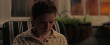 Movie still from “Alice, Darling” (2022), directed by Mary Nighy – A person wearing a sweater; Close Up shot, High angle