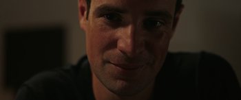Movie still from “Alice, Darling” (2022), directed by Mary Nighy – A man's face in the dark; Close Up shot, Low angle