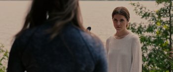 Movie still from “Alice, Darling” (2022), directed by Mary Nighy – A woman standing in front of another woman in front of a body of water; Close Up shot, Over the shoulder angle