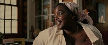 Movie still from “Alice, Darling” (2022), directed by Mary Nighy – A person wearing a headscarf; Close Up shot, Over the shoulder angle