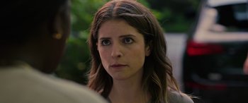 Movie still from “Alice, Darling” (2022), directed by Mary Nighy – A person with long brown hair; Close Up shot, Over the shoulder angle