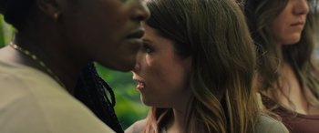 Movie still from “Alice, Darling” (2022), directed by Mary Nighy – A man and a woman face to face in front of trees; Close Up shot, Over the shoulder angle