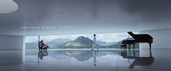 Movie still from “Alien: Covenant” (2017), directed by Ridley Scott – A man walking across a glass floor in front of mountains; Extreme Wide shot, Low angle