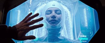 Movie still from “Alien: Covenant” (2017), directed by Ridley Scott – A woman in a white body suit and a white hat; Close Up shot, Overhead angle