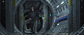 Movie still from “Alien: Covenant” (2017), directed by Ridley Scott – A man standing inside of an underground tunnel; Wide shot, Low angle