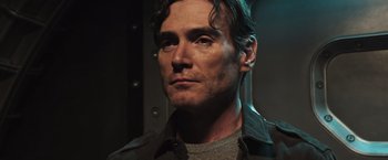 Movie still from “Alien: Covenant” (2017), directed by Ridley Scott – A person wearing a jacket; Close Up shot, Low angle