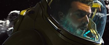 Movie still from “Alien: Covenant” (2017), directed by Ridley Scott – A man in a space suit is reflected in a mirror; Close Up shot, Low angle
