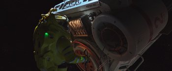 Movie still from “Alien: Covenant” (2017), directed by Ridley Scott – A man in a yellow jacket is standing next to an electrical box; Extreme Wide shot, Overhead angle