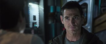 Movie still from “Alien: Covenant” (2017), directed by Ridley Scott – A person wearing a jacket; Close Up shot, Over the shoulder angle