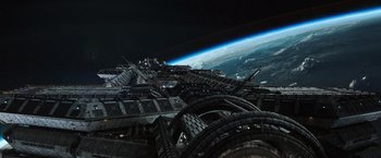 Movie still from “Alien: Covenant” (2017), directed by Ridley Scott – A view of a space station from above the earth's surface; Extreme Wide shot, Overhead angle