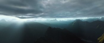 Movie still from “Alien: Covenant” (2017), directed by Ridley Scott – A view of a mountain range from a helicopter; Extreme Wide shot, High angle