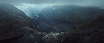 Movie still from “Alien: Covenant” (2017), directed by Ridley Scott – A body of water surrounded by mountains and clouds; Extreme Wide shot, High angle