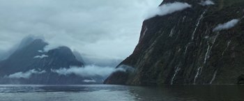 Movie still from “Alien: Covenant” (2017), directed by Ridley Scott – A body of water surrounded by mountains and clouds; Extreme Wide shot, High angle
