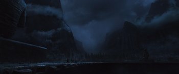 Movie still from “Alien: Covenant” (2017), directed by Ridley Scott – A view of a mountain range in the dark; Extreme Wide shot, High angle