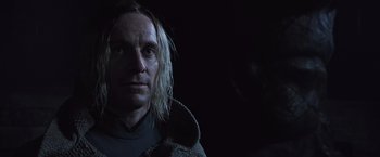 Movie still from “Alien: Covenant” (2017), directed by Ridley Scott – A man with blonde hair is looking at the camera; Close Up shot, Low angle