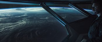 Movie still from “Alien: Covenant” (2017), directed by Ridley Scott – A view from a window of a space station; Extreme Wide shot, Overhead angle