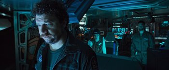 Movie still from “Alien: Covenant” (2017), directed by Ridley Scott – A man and a woman in a vehicle in a room; Close Up shot, Over the shoulder angle