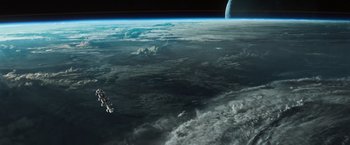 Movie still from “Alien: Covenant” (2017), directed by Ridley Scott – An image of a space ship in the sky above the earth; Extreme Wide shot, High angle