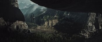 Movie still from “Alien: Covenant” (2017), directed by Ridley Scott – An aerial view of a forest and mountains with trees; Extreme Wide shot, High angle