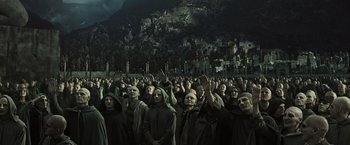 Movie still from “Alien: Covenant” (2017), directed by Ridley Scott – A group of people dressed in black and wearing masks; Wide shot, High angle