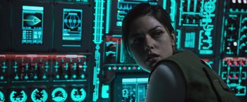 Movie still from “Alien: Covenant” (2017), directed by Ridley Scott – A woman standing in front of a computer screen; Close Up shot, Low angle