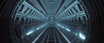 Movie still from “Alien: Covenant” (2017), directed by Ridley Scott – An empty subway train tunnel with lights on the ceiling; Extreme Wide shot, Overhead angle