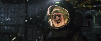 Movie still from “Alien: Covenant” (2017), directed by Ridley Scott – A man wearing a space suit and a helmet; Close Up shot, Low angle