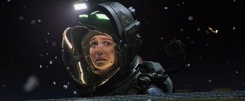 Movie still from “Alien: Covenant” (2017), directed by Ridley Scott – A woman in a space suit looking up at the sky; Close Up shot, Low angle