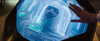 Movie still from “Alien: Covenant” (2017), directed by Ridley Scott – A person in a space suit in a room; Close Up shot, Overhead angle