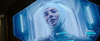 Movie still from “Alien: Covenant” (2017), directed by Ridley Scott – A woman wearing a white body suit and a white hat; Close Up shot, Overhead angle
