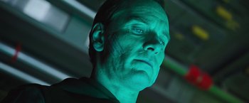 Movie still from “Alien: Covenant” (2017), directed by Ridley Scott – A person with a green light on their face; Close Up shot, Low angle