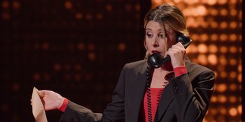 Movie still from “All About Gila” (2022), directed by Arturo González-Campos – A woman holding a phone up to her ear; Close Up shot, High angle