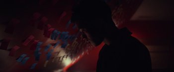 Movie still from “All the Bright Places” (2020), directed by Brett Haley – A man is looking down at a wall of papers; Close Up shot, Low angle