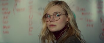 Movie still from “All the Bright Places” (2020), directed by Brett Haley – A woman with glasses is looking at the camera; Close Up shot, Over the shoulder angle