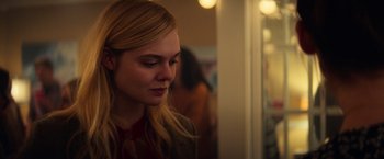 Movie still from “All the Bright Places” (2020), directed by Brett Haley – A young blonde haired woman looking down at her face; Close Up shot, Over the shoulder angle