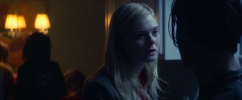 Movie still from “All the Bright Places” (2020), directed by Brett Haley – A woman with long blonde hair sitting in front of a window; Close Up shot, Over the shoulder angle