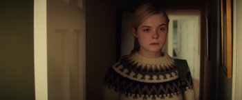 Movie still from “All the Bright Places” (2020), directed by Brett Haley – A young girl wearing a sweater in the dark; Close Up shot, High angle