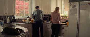 Movie still from “All the Bright Places” (2020), directed by Brett Haley – A man and a woman standing in a kitchen preparing a meal; Medium shot, Low angle