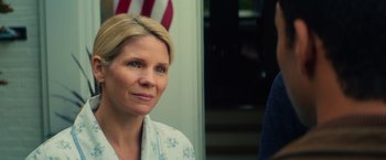 Movie still from “All the Bright Places” (2020), directed by Brett Haley – A person with a flag in the background; Close Up shot, Over the shoulder angle