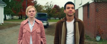 Movie still from “All the Bright Places” (2020), directed by Brett Haley – A man and a woman standing next to each other on the side of the road; Medium shot, Over the shoulder angle