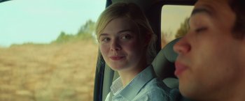 Movie still from “All the Bright Places” (2020), directed by Brett Haley – A woman sitting in the passenger seat of a car; Close Up shot, Over the shoulder angle