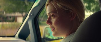 Movie still from “All the Bright Places” (2020), directed by Brett Haley – A young woman looking out of the window of a car; Close Up shot, Over the shoulder angle