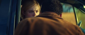 Movie still from “All the Bright Places” (2020), directed by Brett Haley – A woman looking at a man in a brown jacket; Close Up shot, Over the shoulder angle