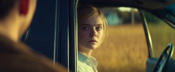 Movie still from “All the Bright Places” (2020), directed by Brett Haley – A woman looking out of a train window; Close Up shot, Low angle