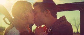 Movie still from “All the Bright Places” (2020), directed by Brett Haley – A man and a woman kissing on the lips; Close Up shot, Low angle